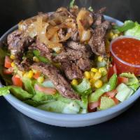 Steak Salad · Rib eye Steak grilled to perfection served on bed of lettuce with your choice of topping and...