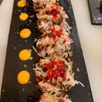 60-Super volcano(Deep Fried) · Tuna, Cream cheese, avocado, topped with spicy snow crab, masago, eel sauce and spicy mayo.