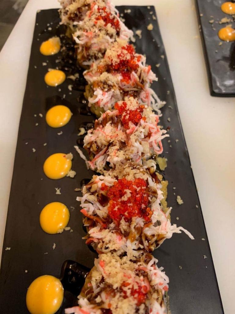 60-Super volcano(Deep Fried) · Tuna, Cream cheese, avocado, topped with spicy snow crab, masago, eel sauce and spicy mayo.