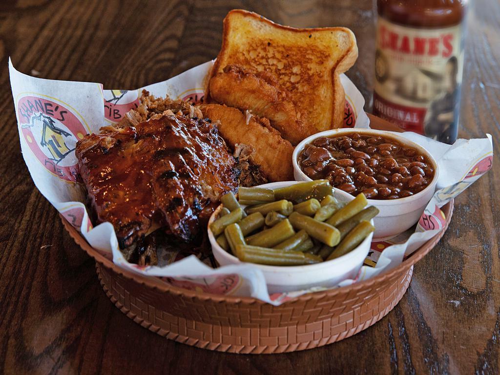 Shack Sampler Plate · 3 baby back ribs, 2 tenders, & 4 oz. of pork or chicken. Served with 2 sides and Texas toast.