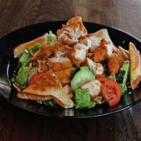 Fried Chicken Tender Salad · Lettuce, tomato, cucumber, crispy onions and Texas toast