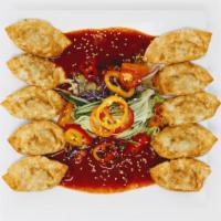 Bibim Mandu(비빔만두) · Fried dumplings with veggies mixed with sweet and spicy sauce.