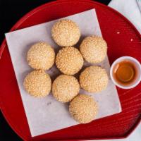  Sesame Balls (8) ·  Red bean filling served with honey syrup.