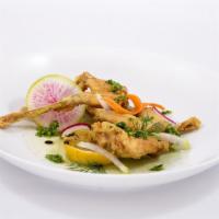 Fried Frog Legs · Classic parsley and garlic butter sauce.