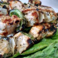 Individual Chicken Skewer · Grilled chicken breast skewered with onion and green pepper.