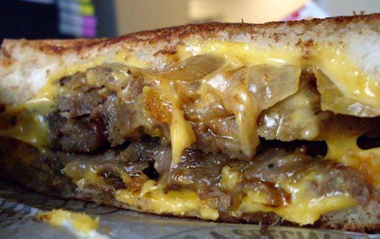 Gyros Melt · Gyros slices with American cheese and grilled onions on toasted rye bread.