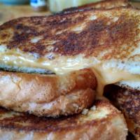 4-Cheeze Grilled Cheese · Your choice of 4 cheese slices slowly melted between 2 slices of buttered toast.