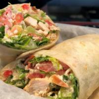 Chicken Caesar Wrap · Grilled chicken breast, Romaine lettuce, tomato and Parmesan cheese tossed with classic, cre...