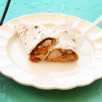 2. Green Regular Burrito · Savory pork simmered in green chile with beans and cheese.