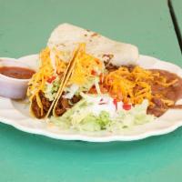 2 Tacos Combo · Served with a salad, flour tortilla, and a side of rice and beans.