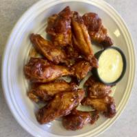 Chicken Wings · Served with blue cheese.