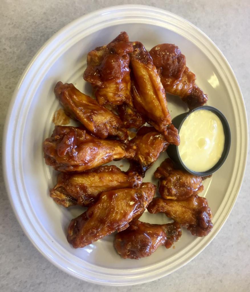 Chicken Wings · Served with blue cheese.
