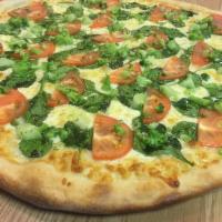 Garlic Veggie Pizza · Broccoli, spinach, tomato and mozzarella. Baked in a stone oven.