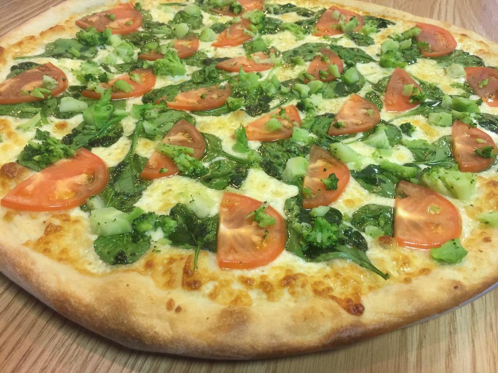 Garlic Veggie Pizza · Broccoli, spinach, tomato and mozzarella. Baked in a stone oven.
