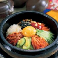 Dolsot Bibimbap 돌솥비빔밥 · Rice topped with vegetables, raw egg and choice of protein in a sizzling stone pot.