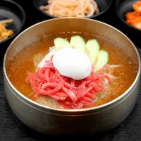 Yukhoe Mul Naengmyeon  육회물냉면 · Buckwheat noodles and marinated beef tartare in cold broth.