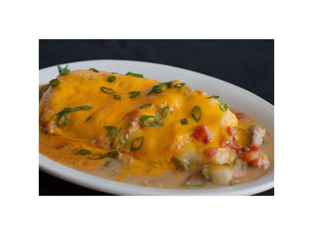 Green Chili Breakfast Burrito · Eggs, country potatoes, and pepper-jack cheese wrapped in a flour tortilla and smothered in our delicious pork green chili