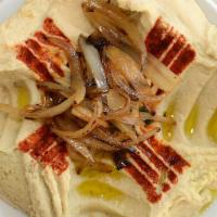 Hummus · A blend of mashed chickpeas with tahini, garlic, lemon and olive oil.