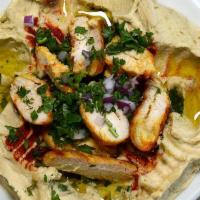 Hummus with Chicken · A blend of mashed chickpeas with tahini, garlic, lemon, and olive oil with chicken.