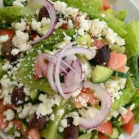 Mykonos Salad · Romaine lettuce, cucumbers, tomatoes, peppers, red onions, Kalamata olives and feta cheese.