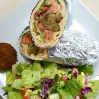 Falafel Sandwich · Golden fried falafel wrapped in choice of bread served with hummus, lettuce, tomatoes and on...
