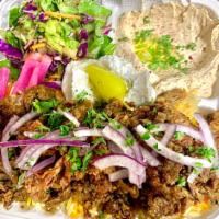 Beef Shawarma Entree · Our beef shawarma served with humus,rice,salad,taziki sauce, pickled turnip, peppercini and ...