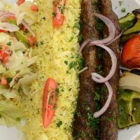 Kofta Kebab · Lean ground beef blended with onions, parsley, and a mix of Oriental spices.  Served with hu...
