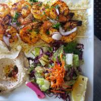 Shrimp Kebab · Shrimp skewers seasoned with herbs and spices, grilled & served with rice, salad, hummus, ga...