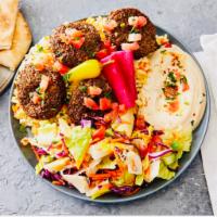 Falafel Plates · 6 pieces of falafel served with humus, rice, salad, tahini sauce, pickled turnip, peppercini...