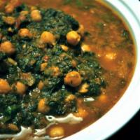 12. Palak Panner · Homemade cottage cheese cooked with fresh spinach, spices, and tomatoes.