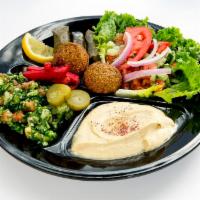 Vegetarian Combination · Dolmeh, falafel, hummus, tabbouleh and house salad served with pita bread and tahini sauce.