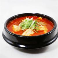 33. Kimchi Jjigae · Kimchi stew with tofu and pork in hot and spicy Korean soup. Spicy.