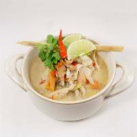 34. Chicken Tom Kha Kai · Chicken, tomato, mushroom, lemongrass, kaffir lime leaf, galanga in coconut broth. Spicy.