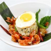 43. Shrimp Basil Fried Rice · Fried rice with fresh basil leaves, eggs and onion topped with egg Sunny Side Up style. Serv...