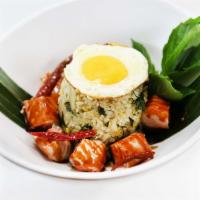 45. Grilled Salmon Basil Fried Rice · Fried rice with fresh basil leaves, eggs and onion topped with egg Sunny Side Up style serve...