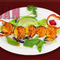 13. Grilled Shrimp · Skewer of 5 pieces of marinated jumbo shrimp grilled and served with fresh green.