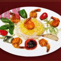 41. Tender Glazed Shrimp Kabab · Marinated jumbo shrimp grilled and served with imported basmati rice topped with saffron.