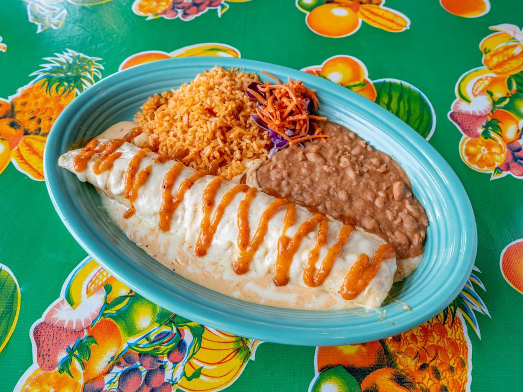 Roasted Chicken Pipeline Enchilada · Roasted chicken breast and Monterey jack cheese rolled in fresh corn tortillas topped with queso blanco sauce, served with rice ＆ refried beans with a salsa roja drizzle.