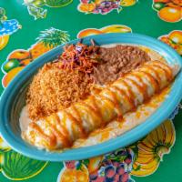 Fajita Beef Pipeline Enchilada · Grilled fajita steak and mixed cheese rolled in fresh corn tortillas topped with salsa roja ...