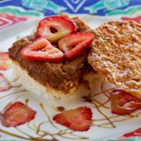 Tres Leches · Traditional mexican cake made with three sweet creams on a bed of creme fraiche, topped with...