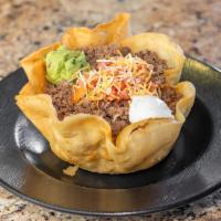 Taco Salad · Choose ground beef orseasoned chicken over a bed of lettuce, refried beans, Mexican rice, ch...