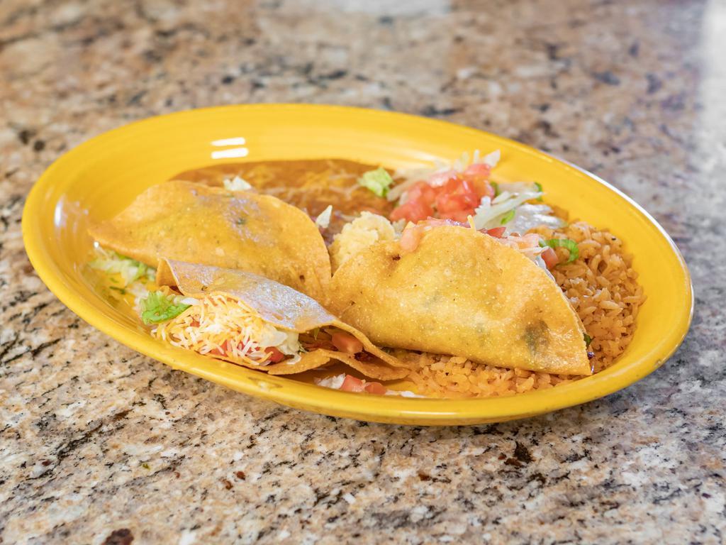 Crispy Taco Platter · 3 tacos deep fried and filled with your choice of seasoned chicken or shredded beef, diced tomatoes and cheese. Served with re-fried beans and rice.