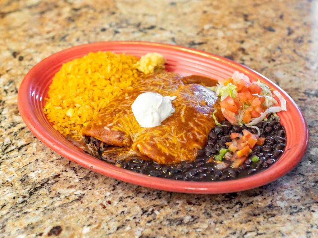 2 Fajita Enchiladas · Bell peppers, onions and your choice or fajita steak or chicken wrapped in 2 flour tortillas with Monterey jack cheese and topped with new texas guajillo salsa. Served with black beans, rice and sour cream.