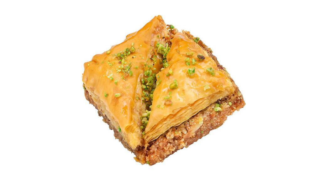 Baklava · Chopped walnuts and almonds layered between flaky Fillo Dough sheets, baked then soaked in sweet honey syrup.
