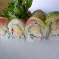 Rainbow Roll · Crab, cucumber and avocado inside, variety of fish outside. Made with brown rice upon request.