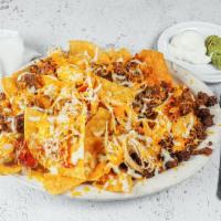 Zapata Nachos · Tortilla chips with beef or chicken fajita, beans, cheese, jalapenos, guacamole and sour cre...