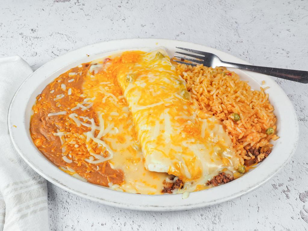 Burrito Dinner · 1 burrito, choice of beef or chicken, topped with your choice of sauce (chili, sour cream or ranchera) and cheese, served with rice and beans.