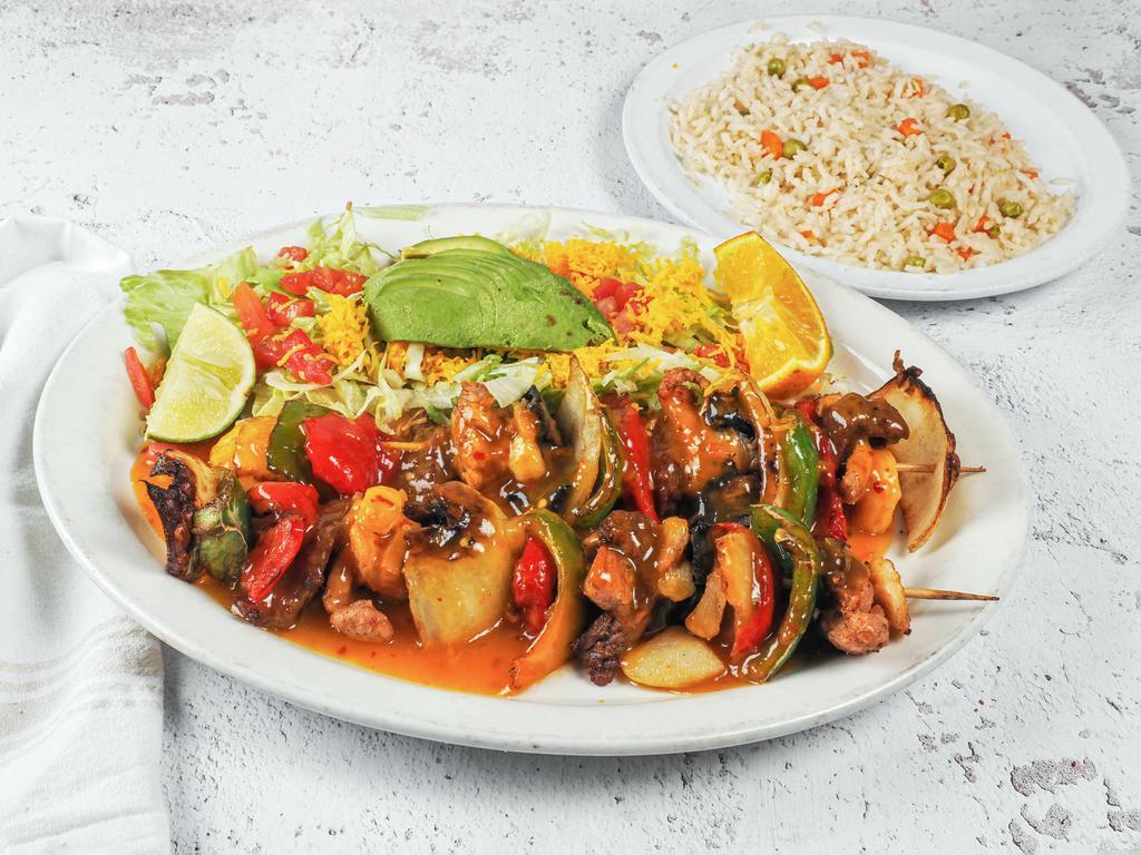 Mango Habanero Skewers · 2 skewers made of beef, chicken, shrimp, yellow bell pepper, pineapple, mushrooms, onion, served with white rice and beans.