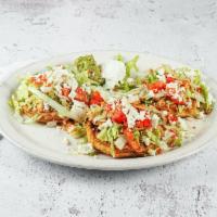 Sopes · 3 sopes with carne asada or chicken, beans, lettuce, tomatoes, cheese, guacamole and sour cr...
