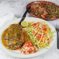 Guaraches · Large and thick corn tortilla with beef steak, beans and nopales, served with guacamole and ...